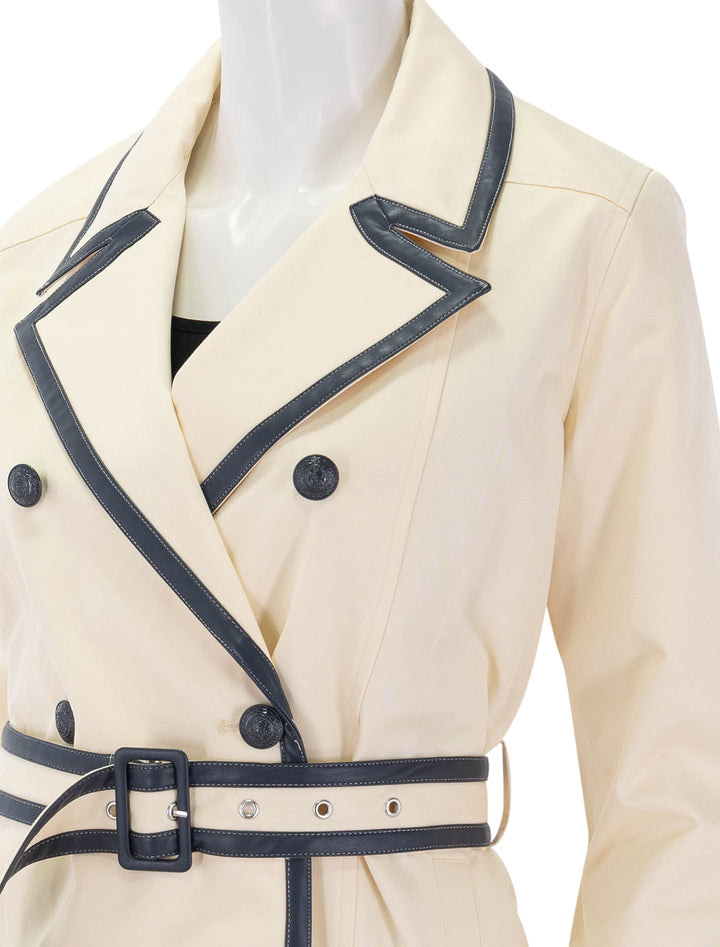 toru leather trim trench in light pearl and midnight