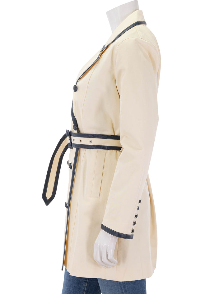 toru leather trim trench in light pearl and midnight