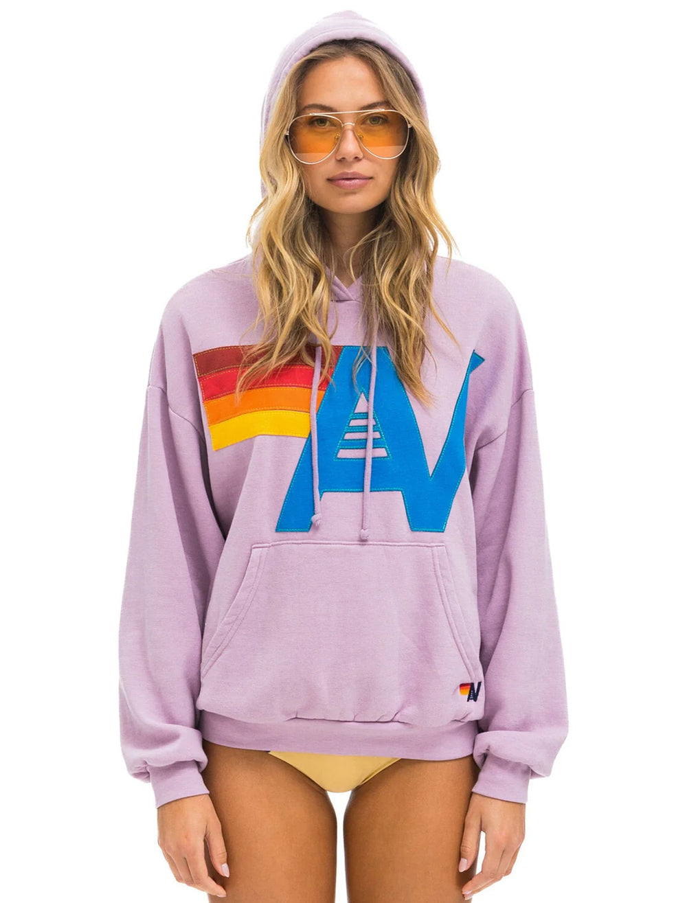 Model wearing Aviator Nation's logo stitch pullover hoodie in mauve.