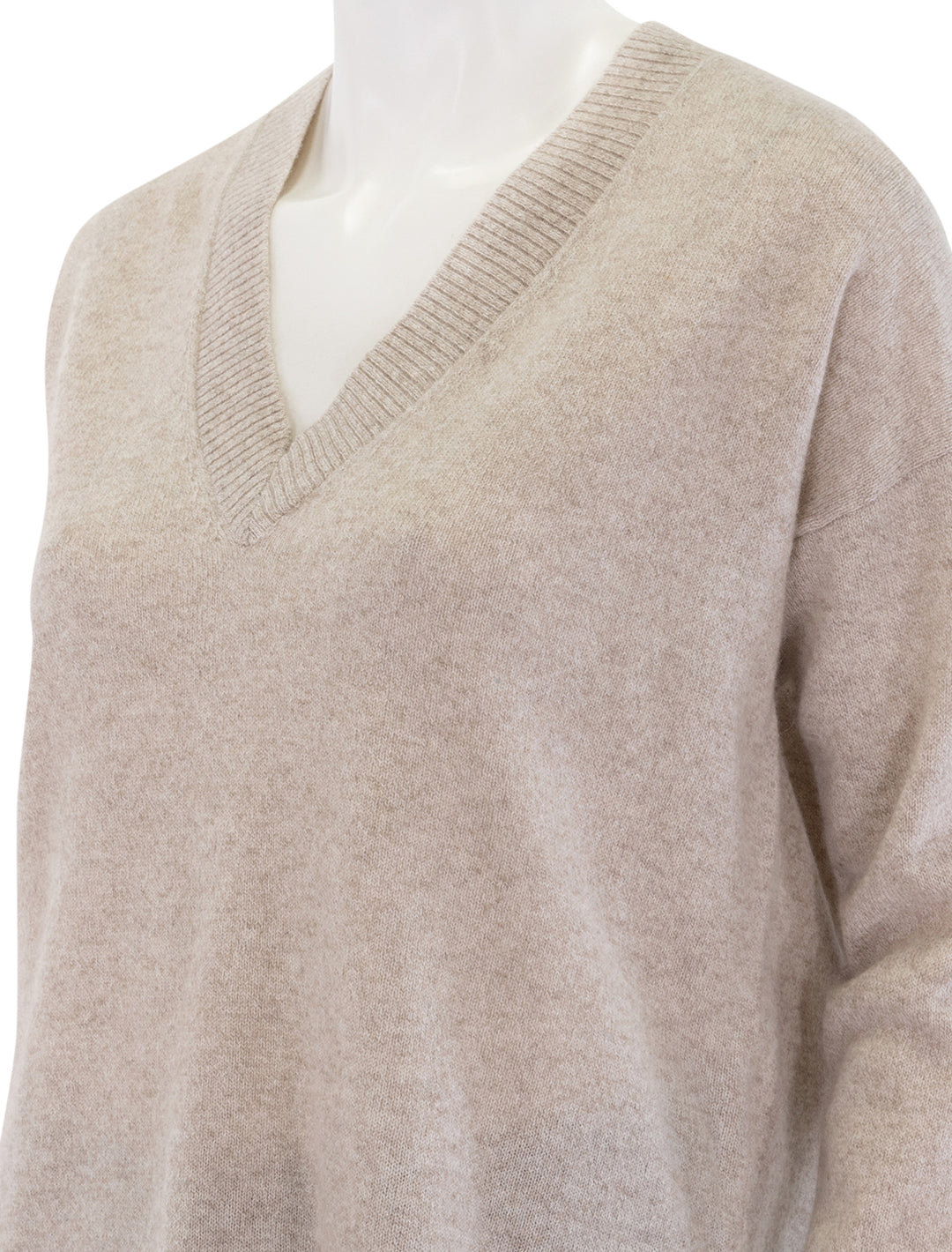 close up view of cashmere long and lean v neck sweater in ecru