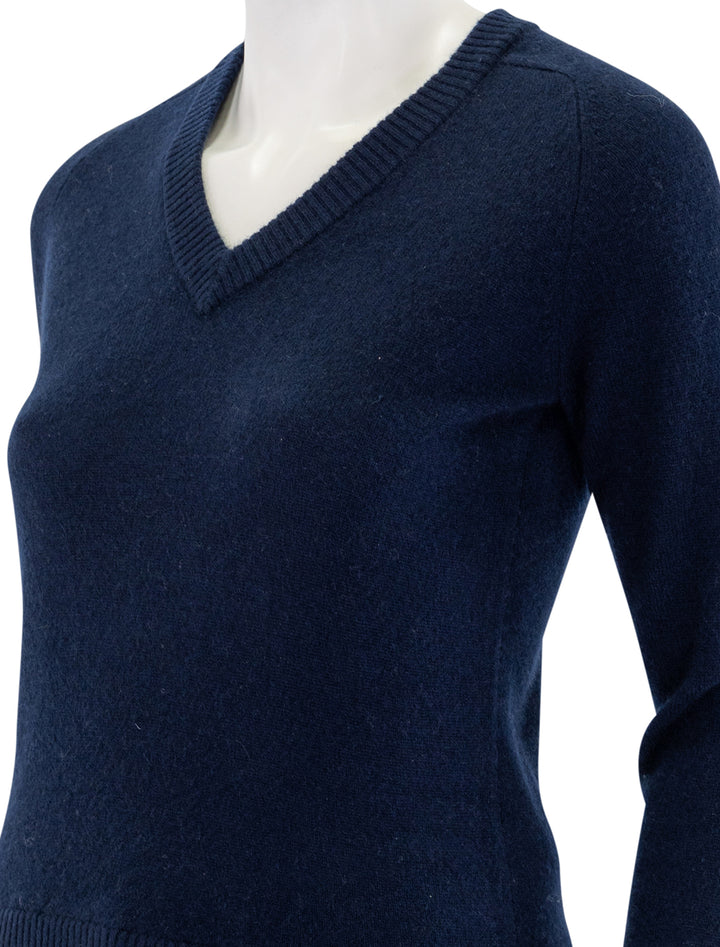 close up view of cashmere v neck raglan pullover in navy