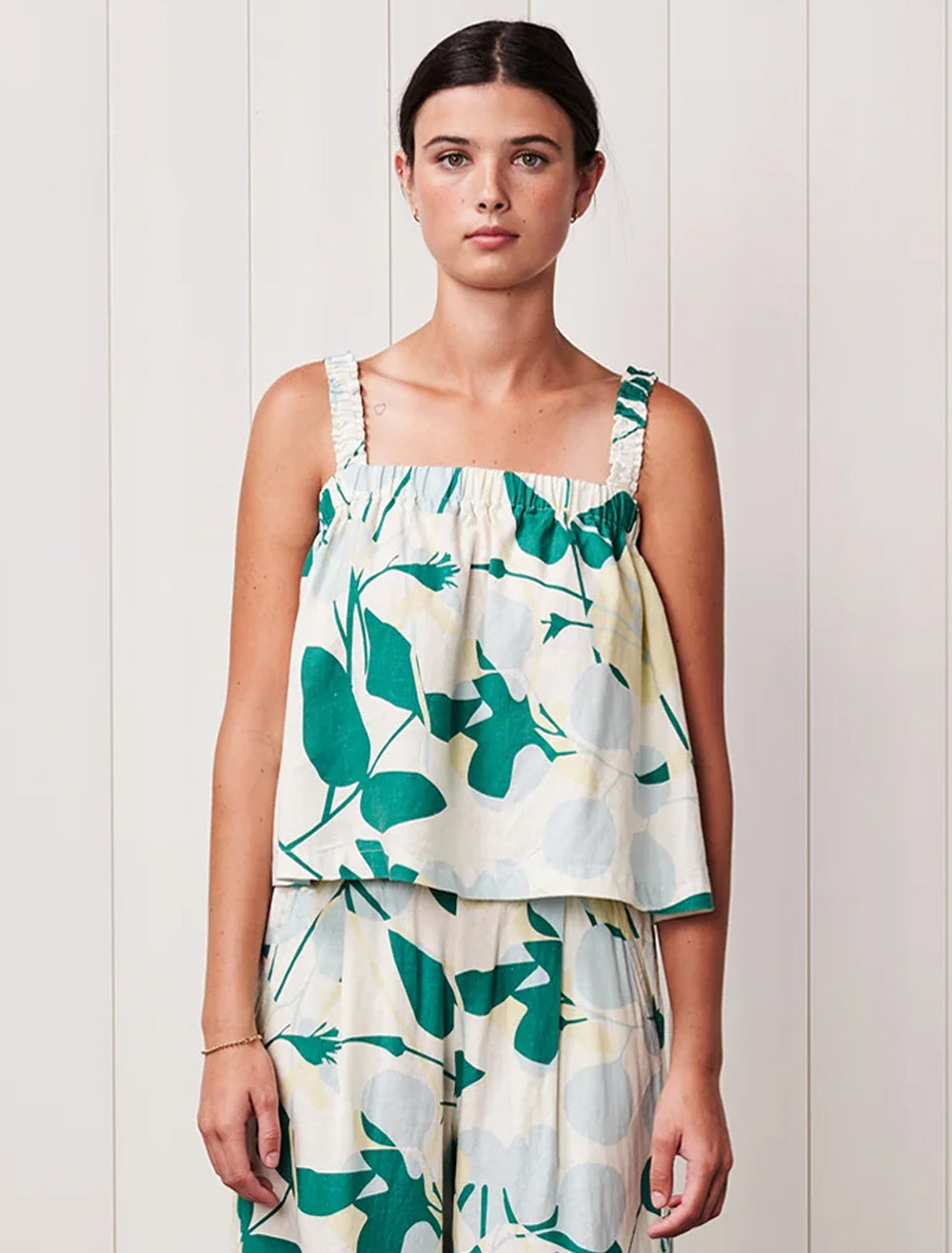 model wearing blossom printed linen ruched shoulder tank