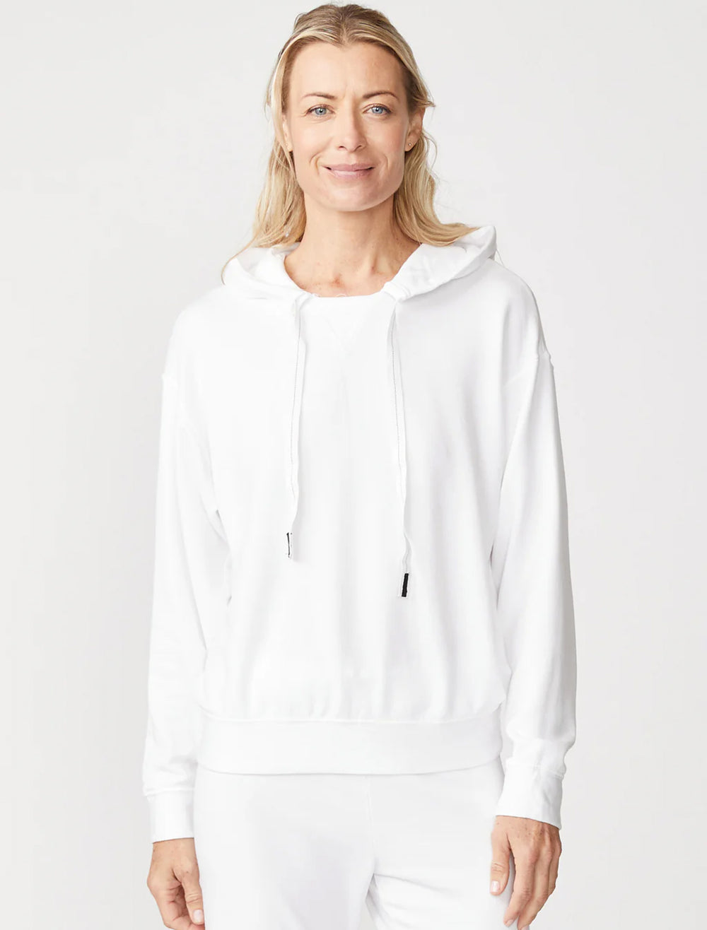 model wearing softest fleece hood pullover in white