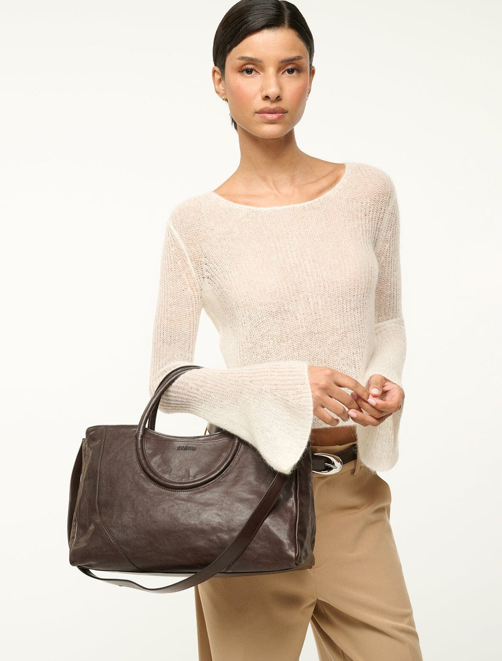 model holding maude satchel in espresso