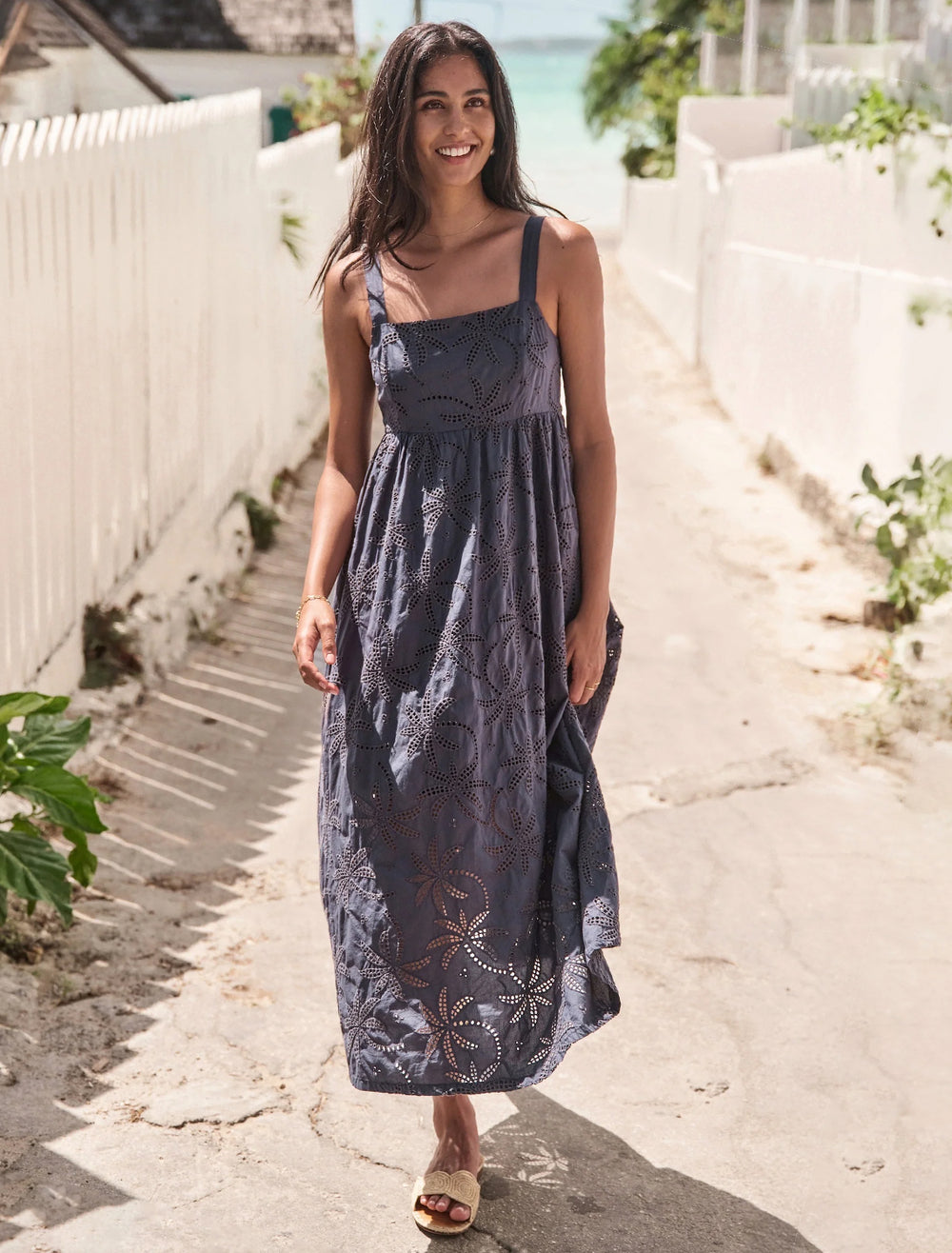 model wearing rosette eyelet dress in indigo