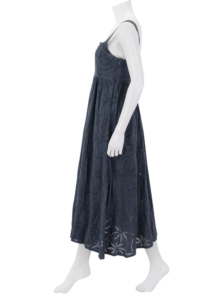 side view of rosette eyelet dress in indigo