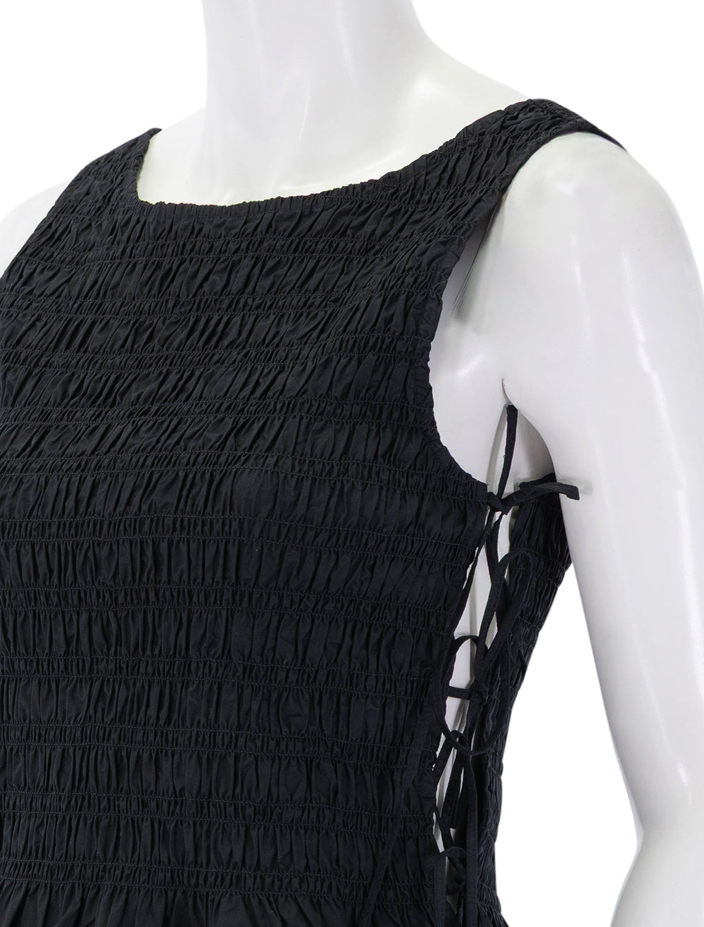 close up view of smock tie string top in black