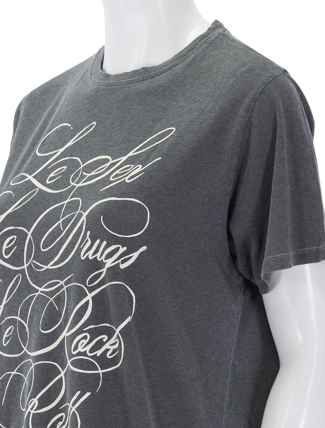 close up view of original tee in faded black & cream