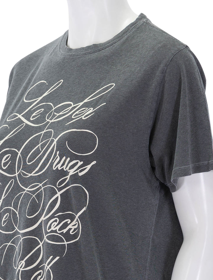 close up view of original tee in faded black & cream