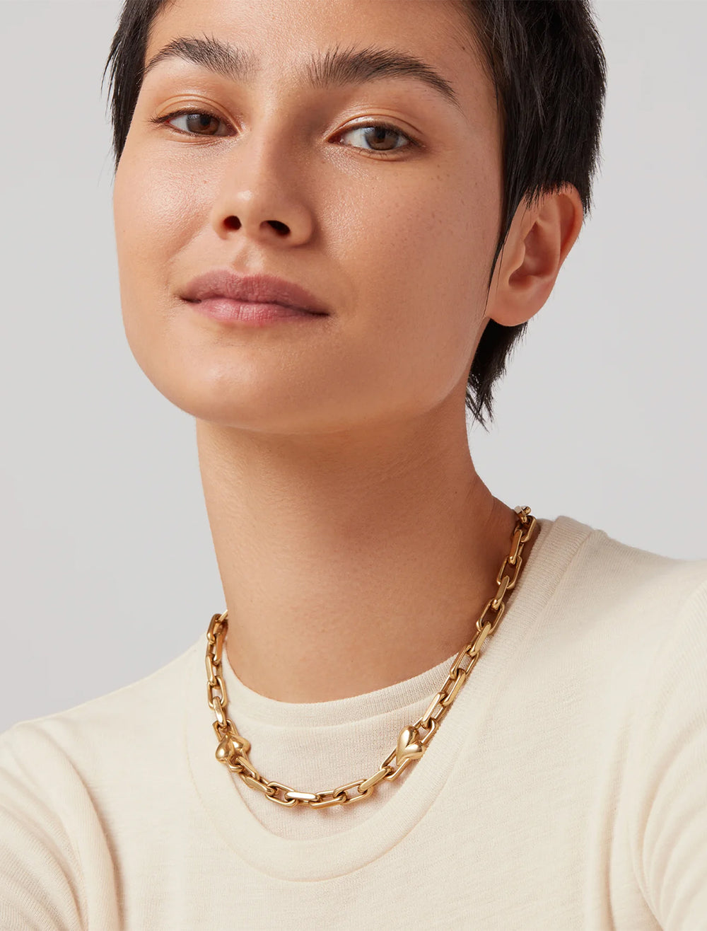 model wearing art heart chain necklace