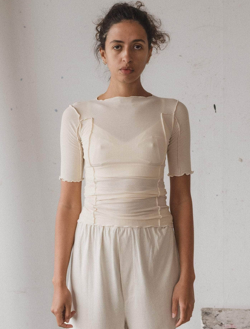 model wearing omato 3/4 sleeve tee in off white