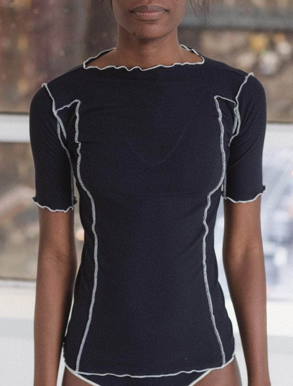 model wearing omato 3/4 length sleeve tee in murano navy