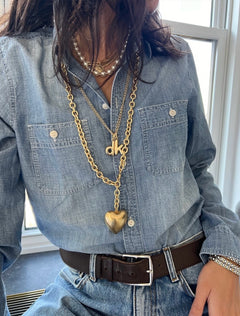 model wearing the puffy initial necklace | d