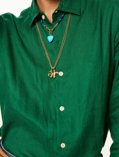 model wearing the puffy initial necklace | r
