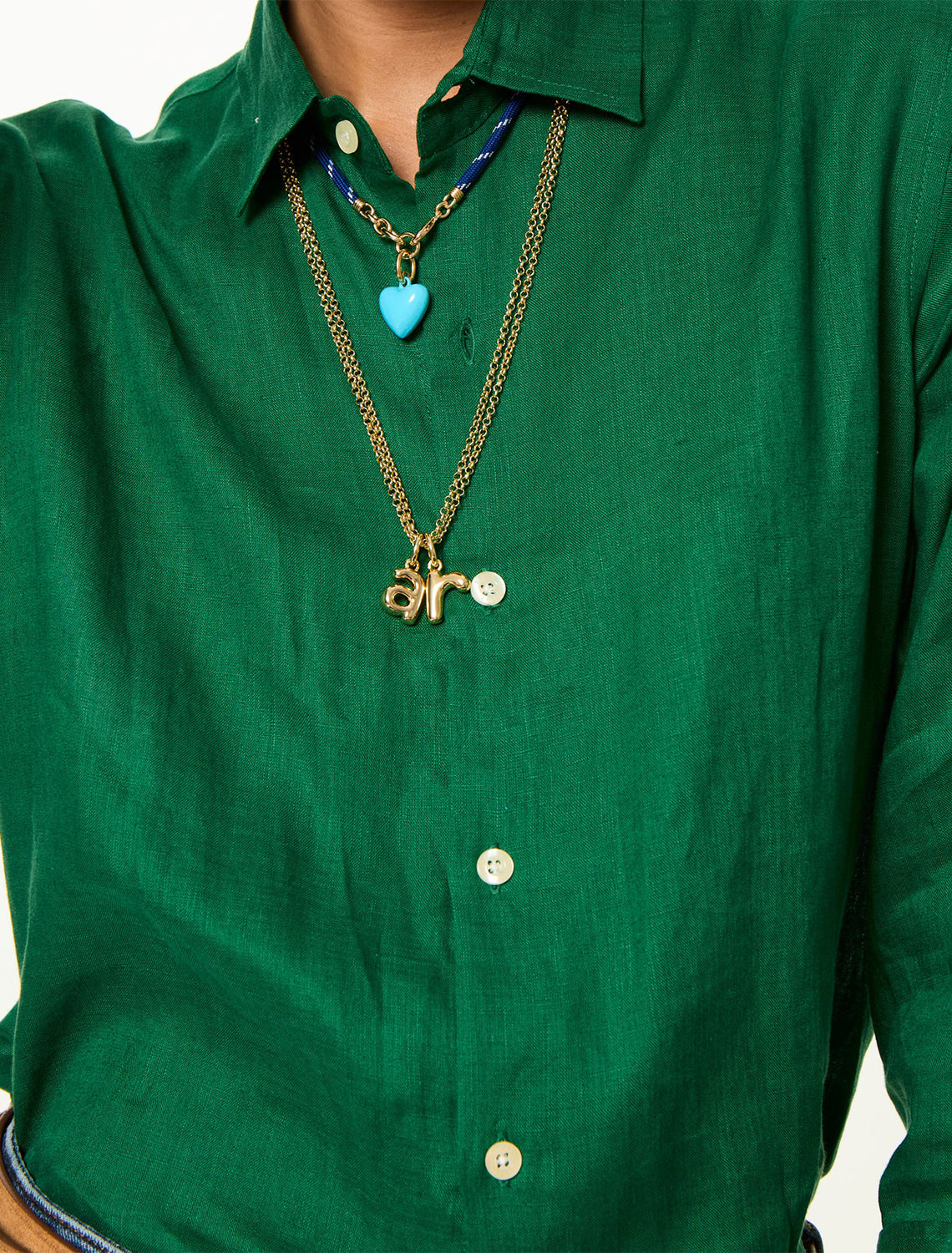 model wearing the puffy initial necklace | r