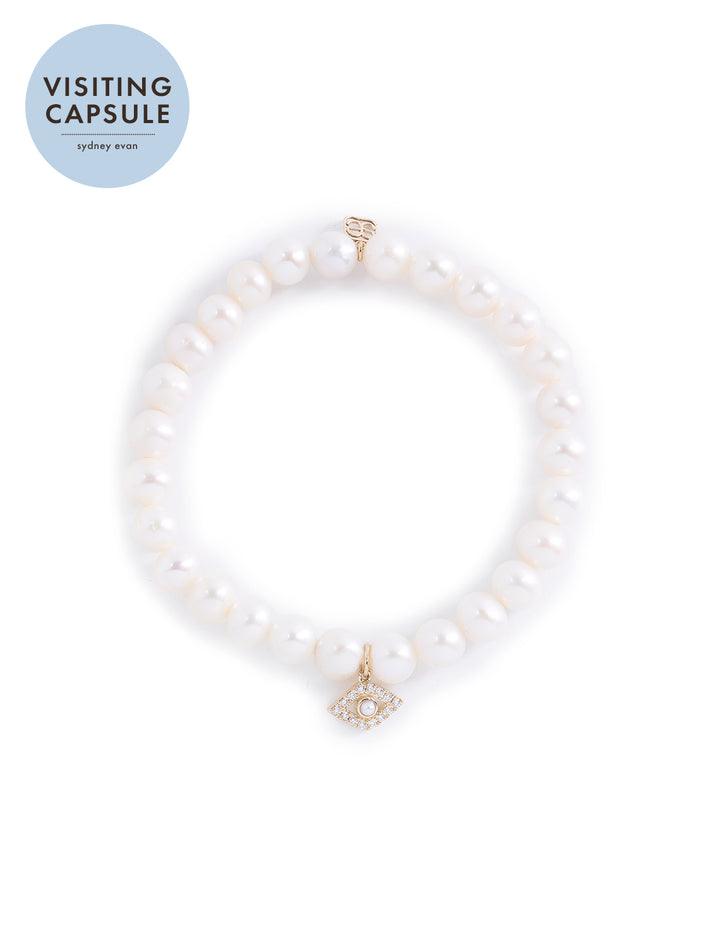 fresh water pearl beaded bracelet with bezel evil eye charm