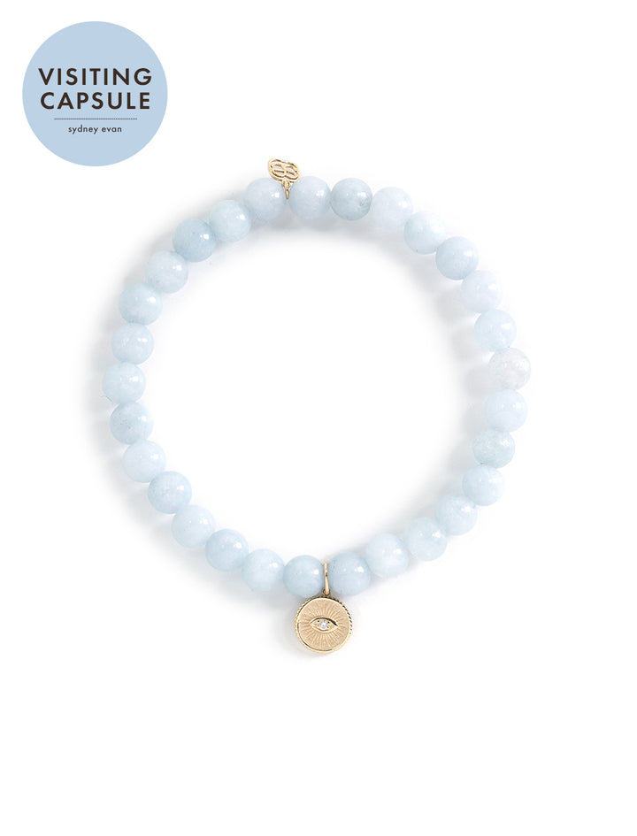 aquamarine beaded bracelet with gold marquise eye coin charm