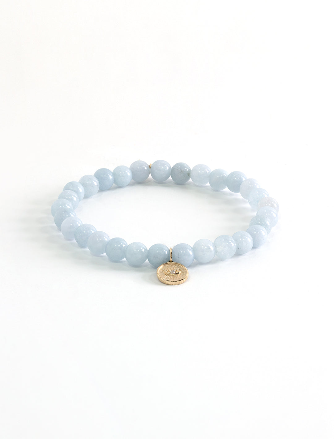 aquamarine beaded bracelet with gold marquise eye coin charm