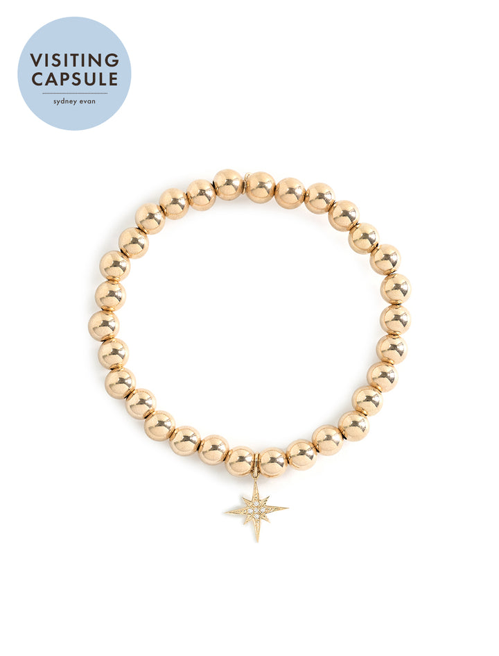 14k gold round beaded bracelet with pave starburst charm