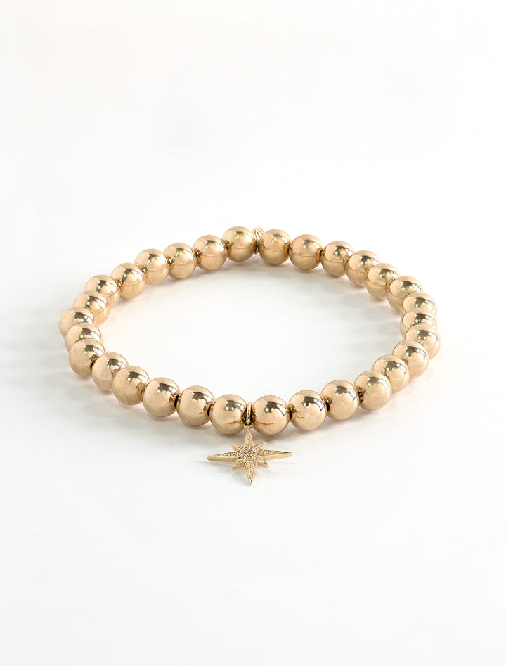 14k gold round beaded bracelet with pave starburst charm