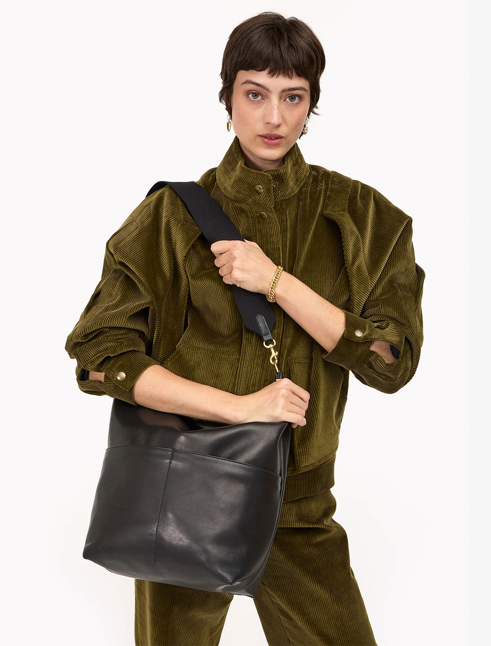 model holding sophie tote in black leather