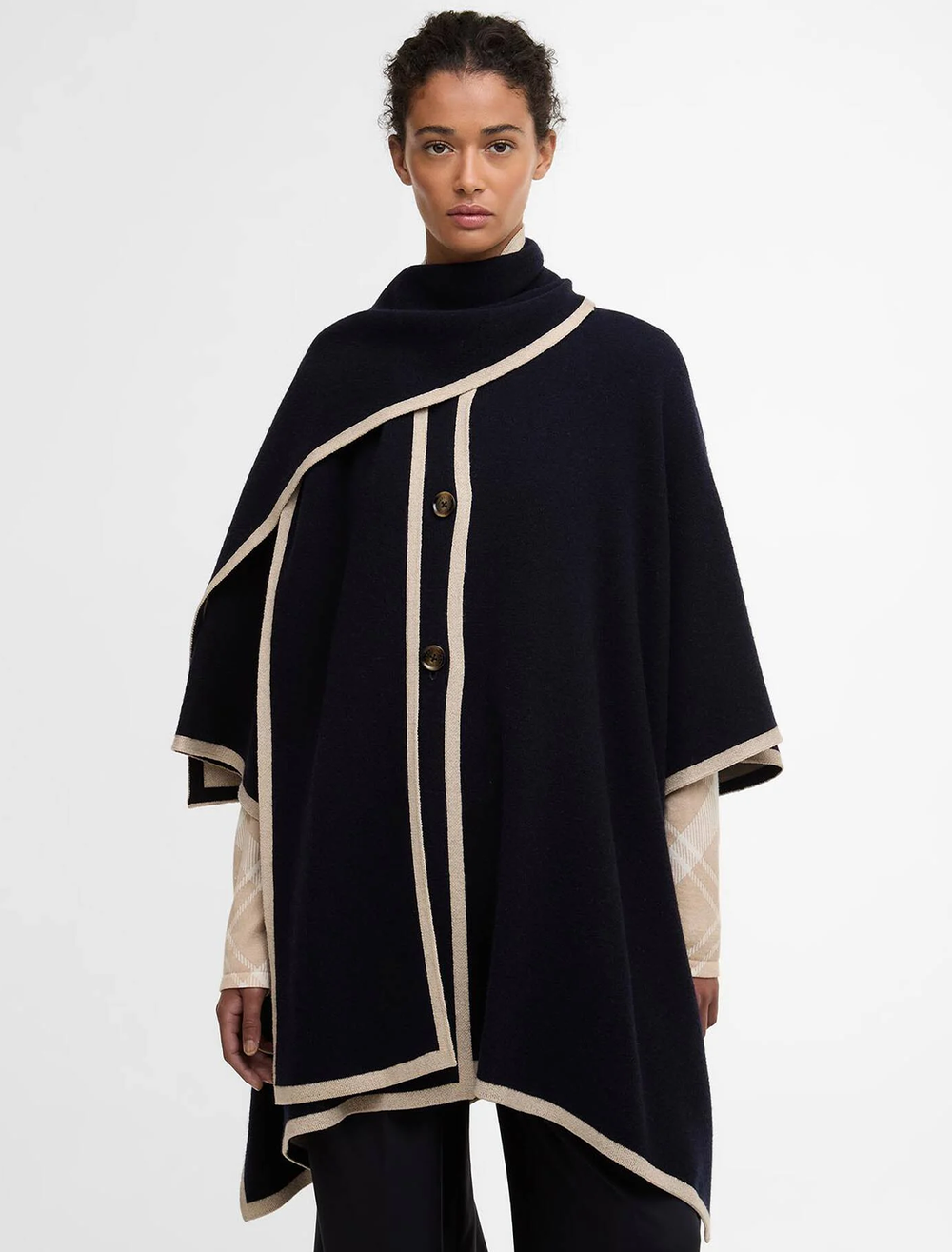 model wearing river knit cape in navy