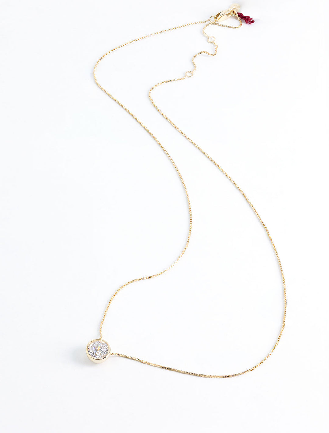 solitaire bezel set necklace in gold