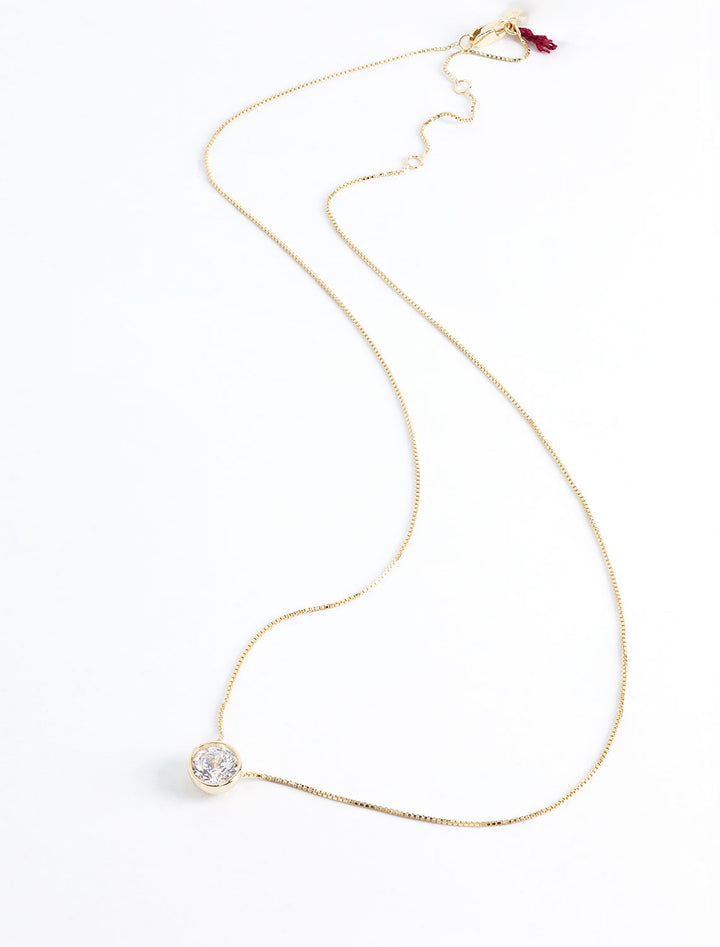 solitaire bezel set necklace in gold