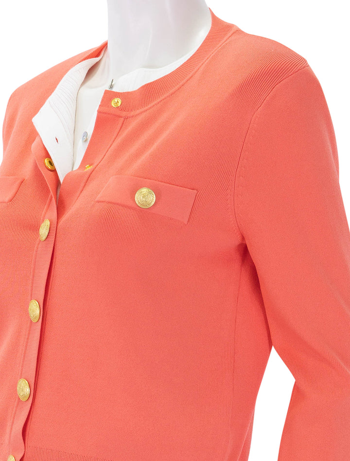 close up view of toulouse crop cardigan in coral rose