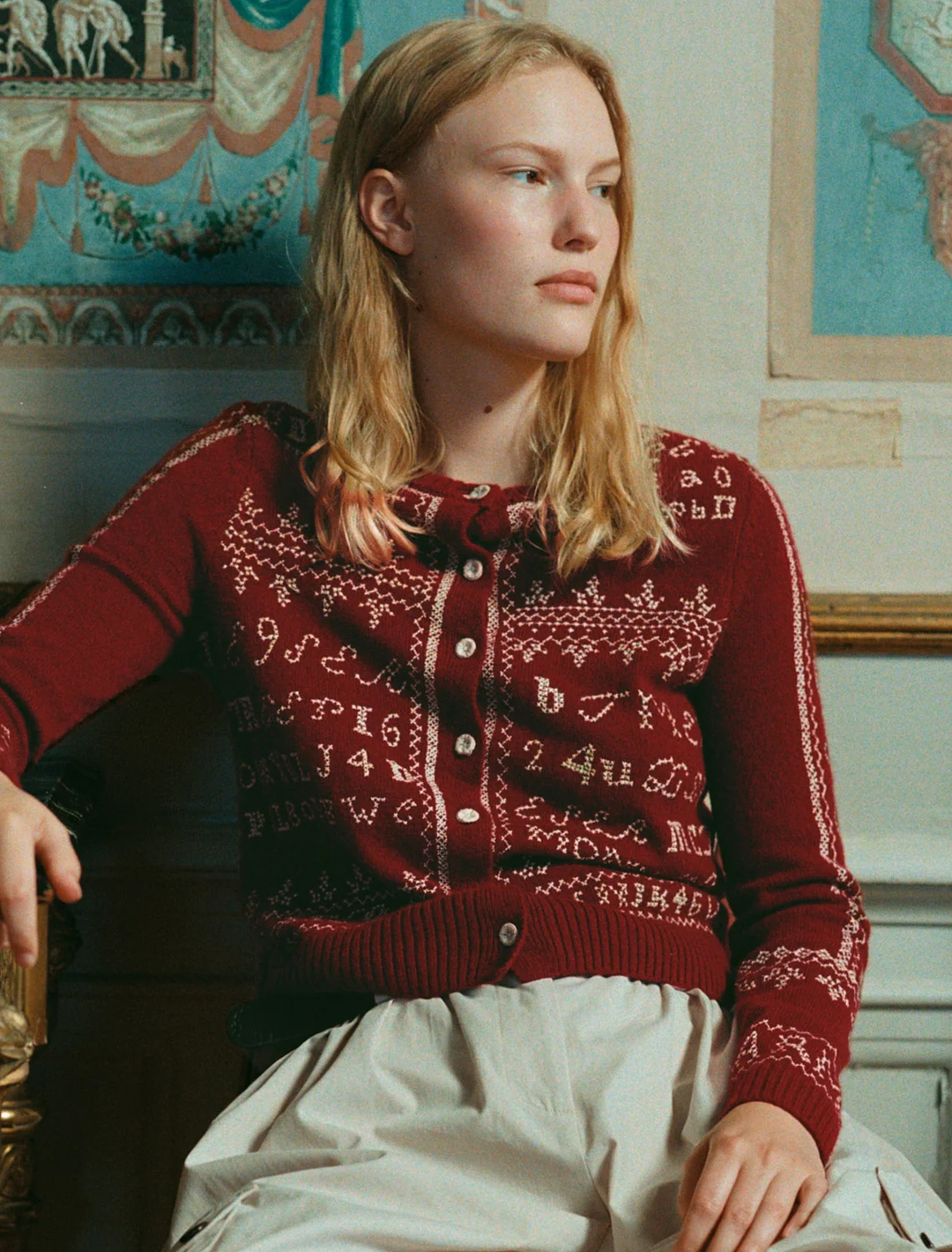 model wearing kit embroidery cardigan in burgundy
