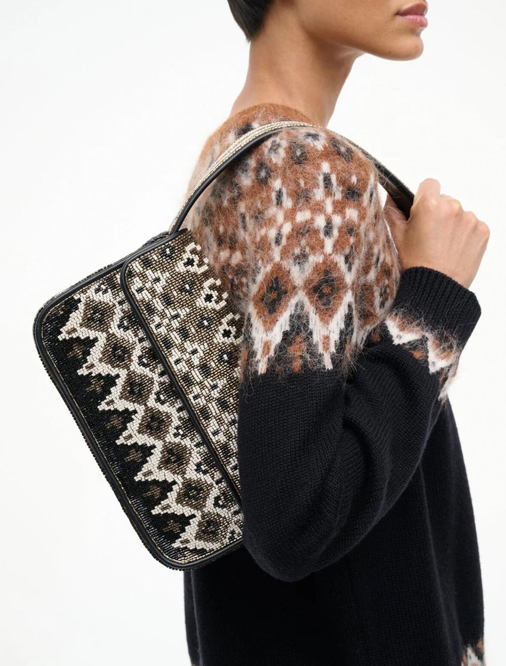 model holding tommy beaded bag in zermatt