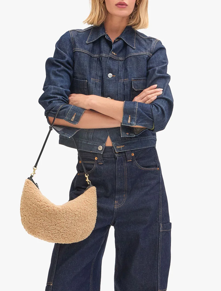 model holding lune shearling in cafe au lait