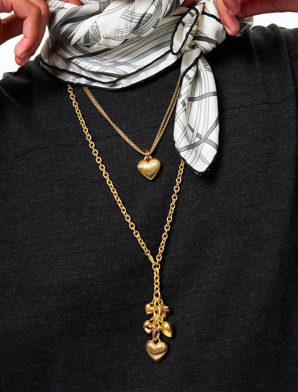 model wearing the mini florentine heart pendant in gold