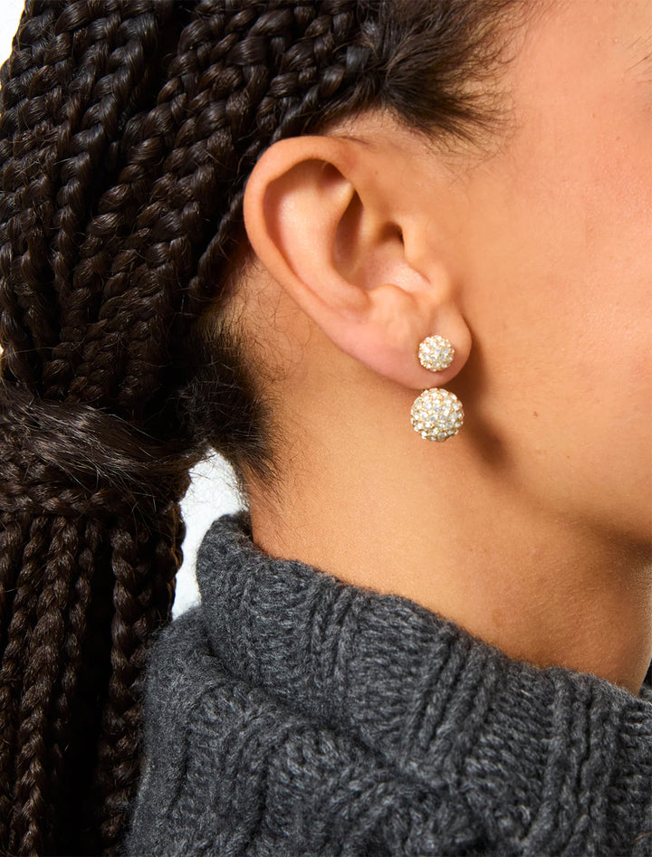 model wearing the floating pavé ball earrings earrings