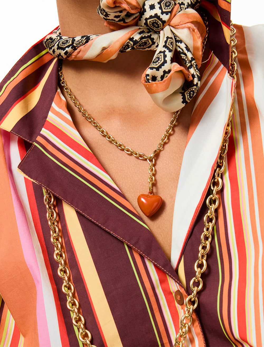 model wearing the mini puffy heart necklace in sienna