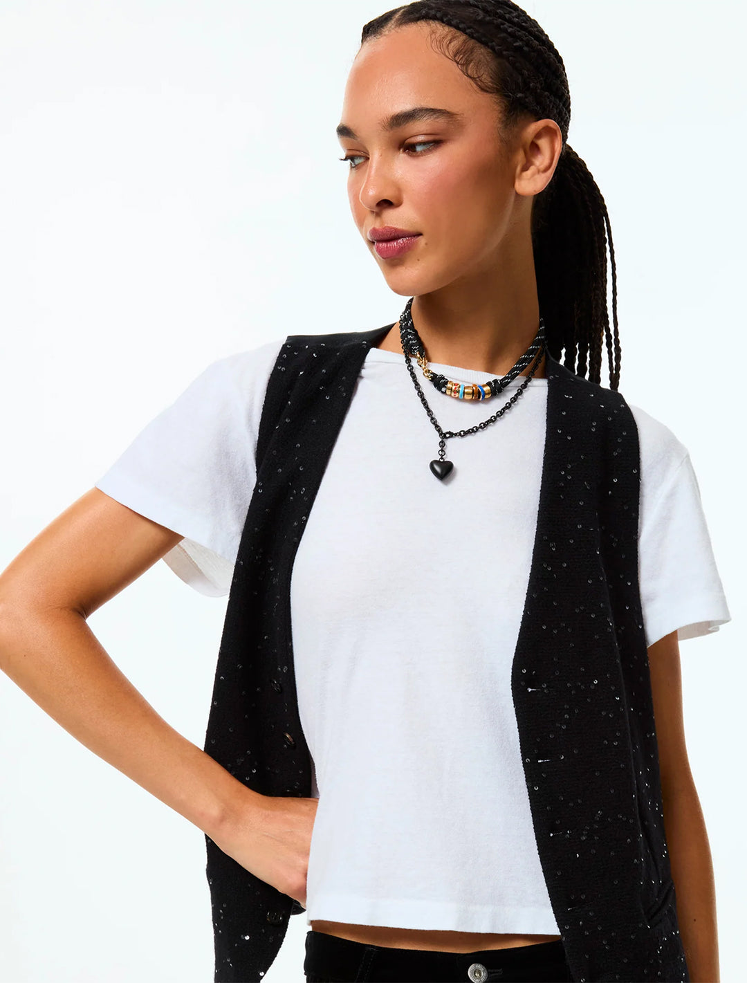 model wearing the mini puffy heart necklace in black