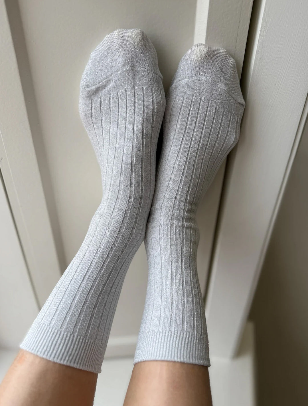 her socks in snow glitter