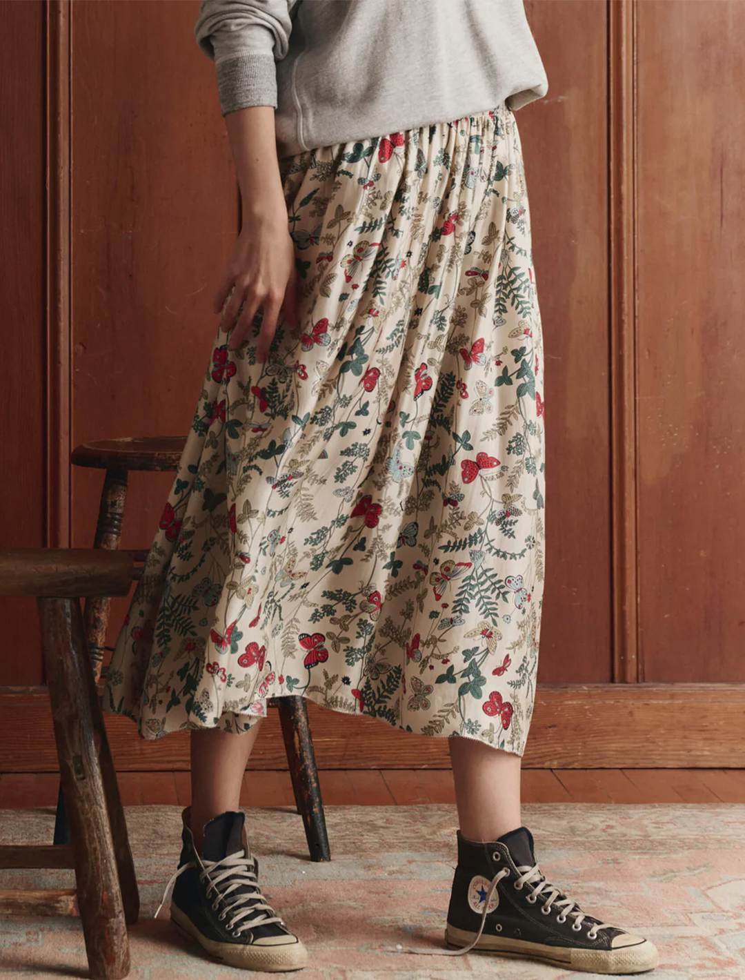 Model wearing The Great's the canary skirt in floating butterfly skirt.