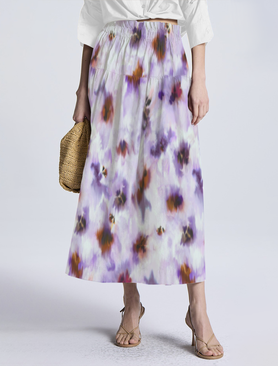 Model wearing ALC's jayden skirt in lilac multi print.