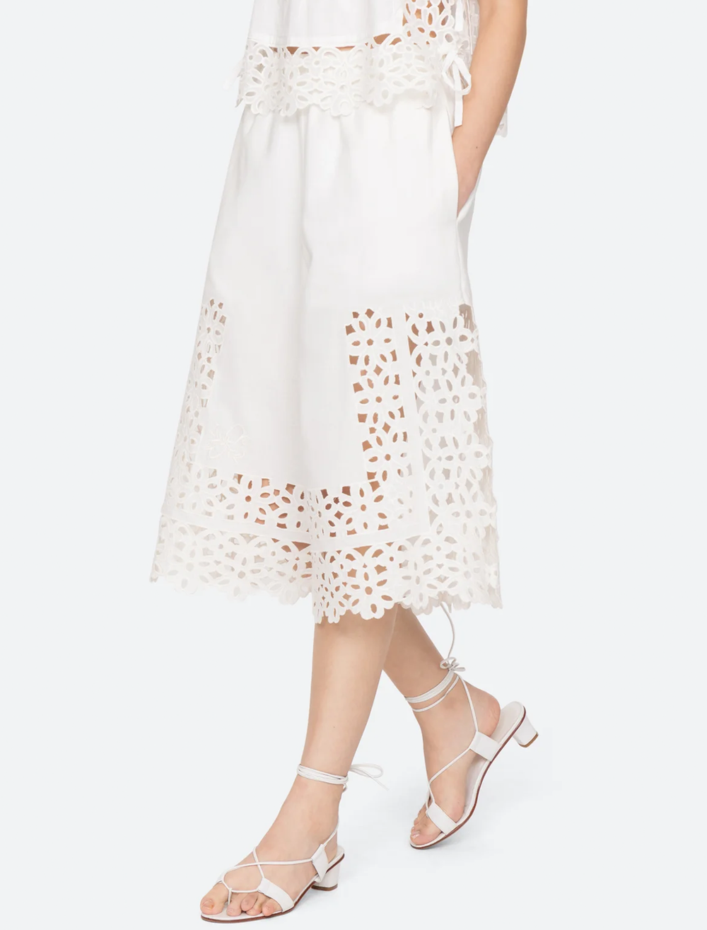 Model wearing Sea NY leila eyelet culottes in white.