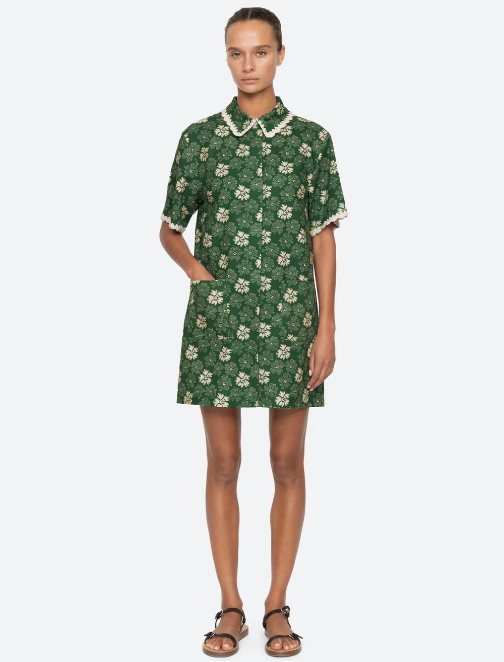 Model wearing Sea NY's gloria print dress in green.
