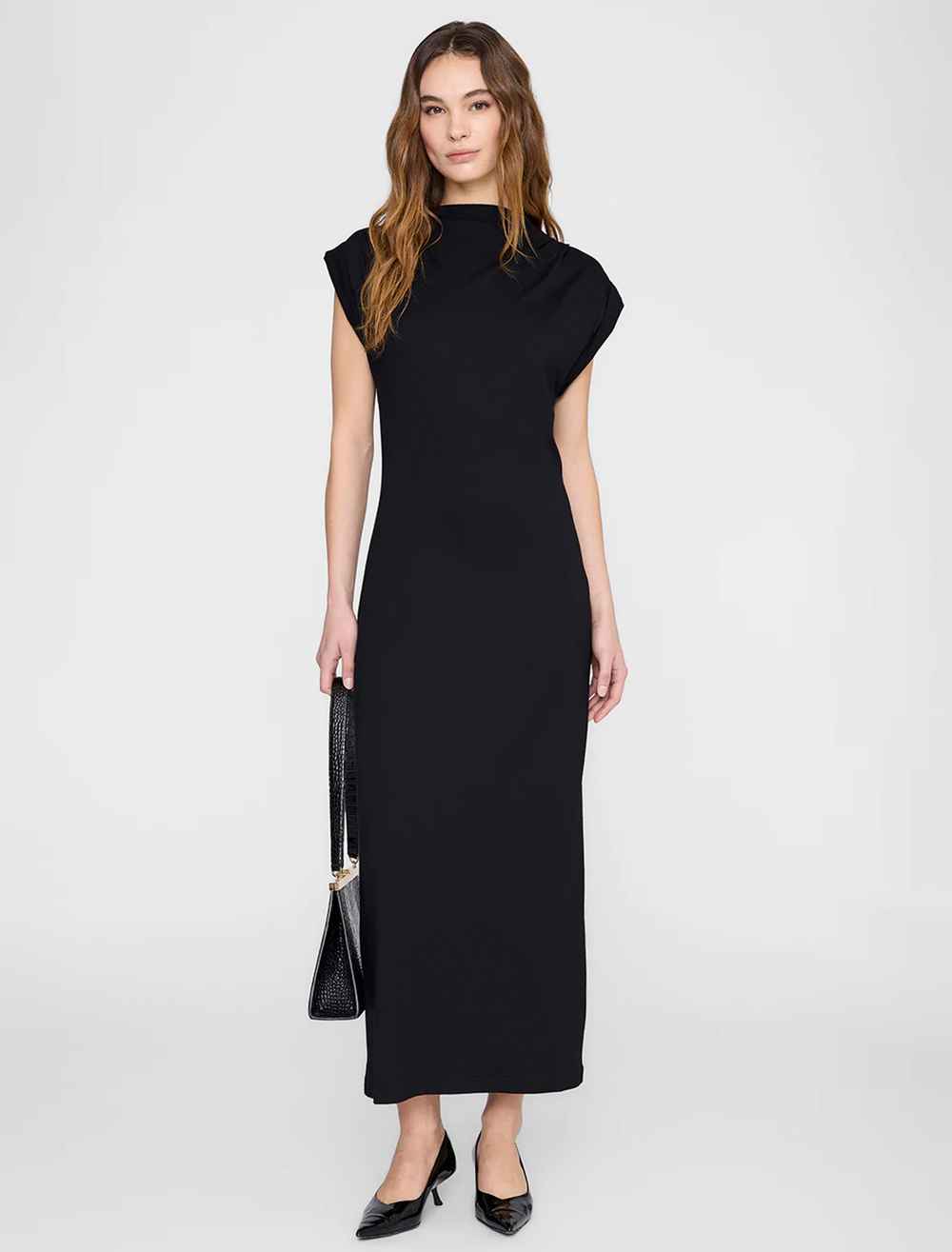 Model wearing Anine Bing's alix dress in black.