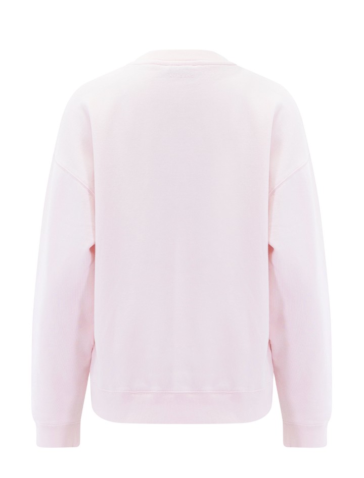 Back view of Anine Bing spencer sweatshirt in powder pink.