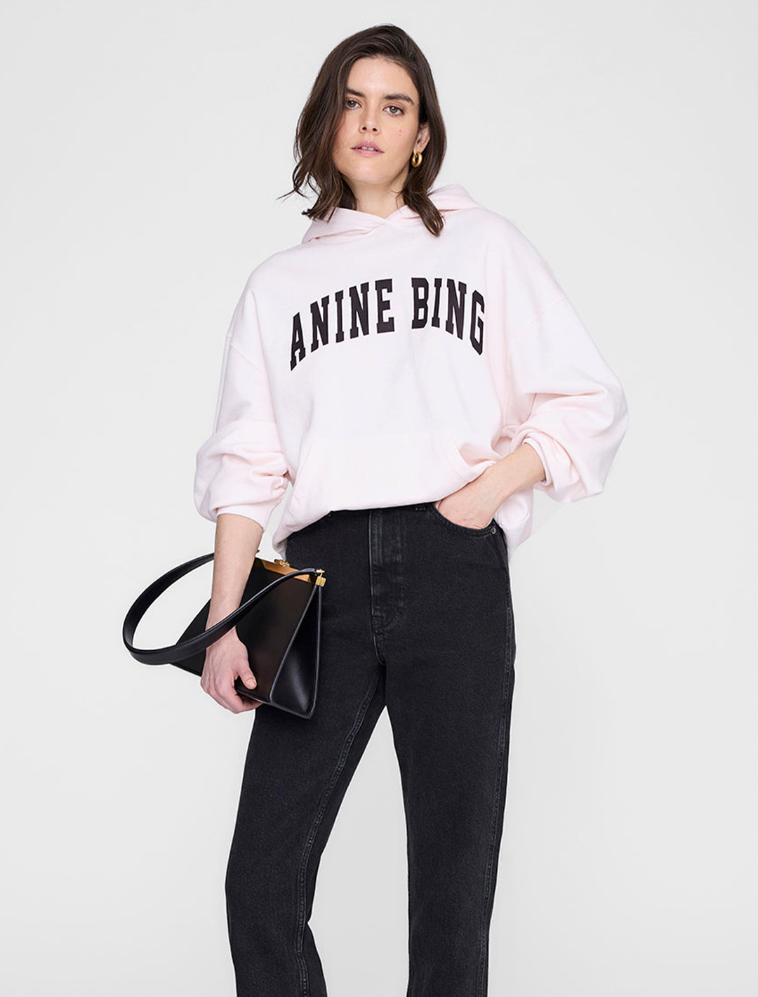 Model wearing Anine Bing's harvey sweatshirt in washed pink.