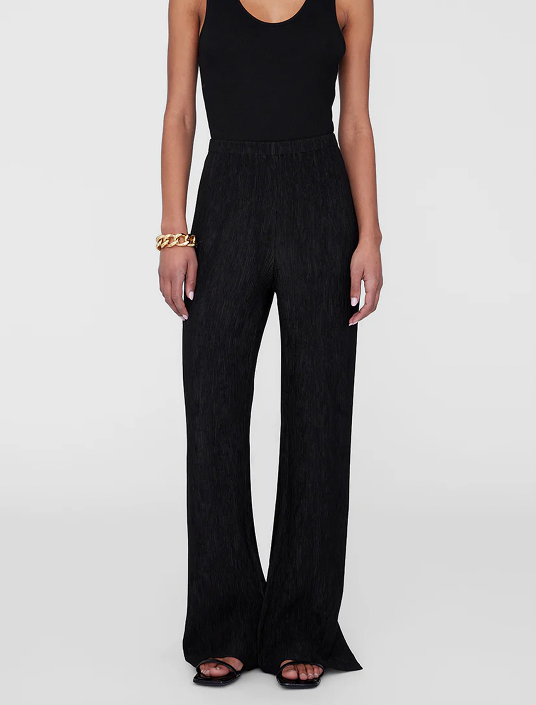 Model wearing Anine Bing's aden plisse pant in black.