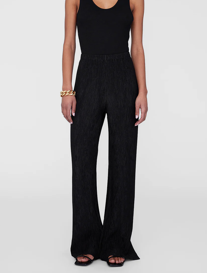 Model wearing Anine Bing's aden plisse pant in black.