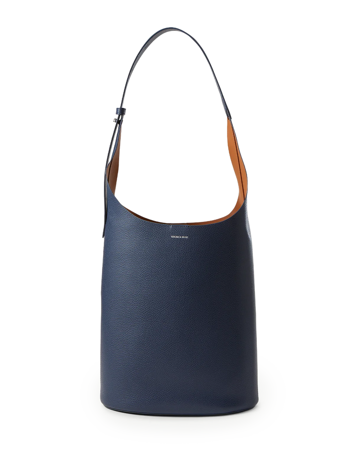 Front view of Veronica Beard's large loop bag in navy and hazelwood leather.
