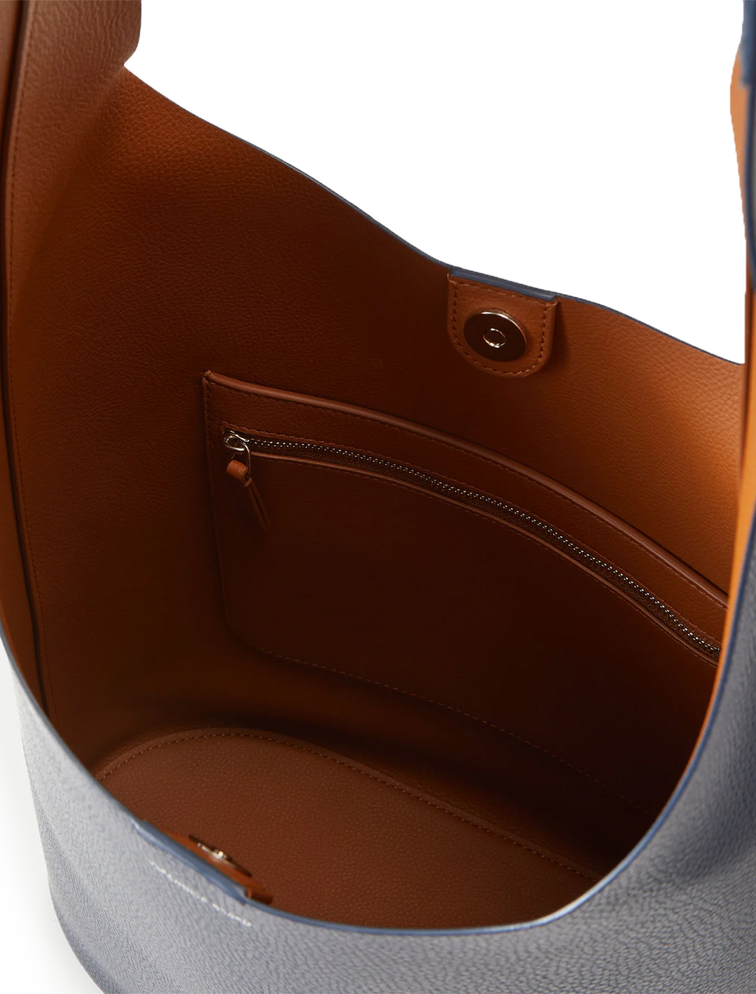 Close-up inside view of Veronica Beard's large loop bag in navy and hazelwood leather.