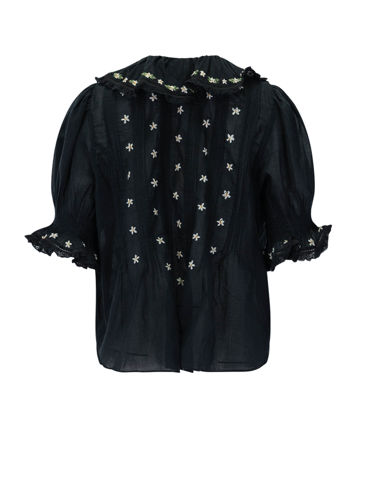 back view of hettie top in black with floral embroidery