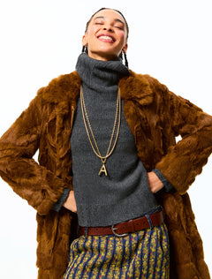 model wearing the big puffy initial necklace | A